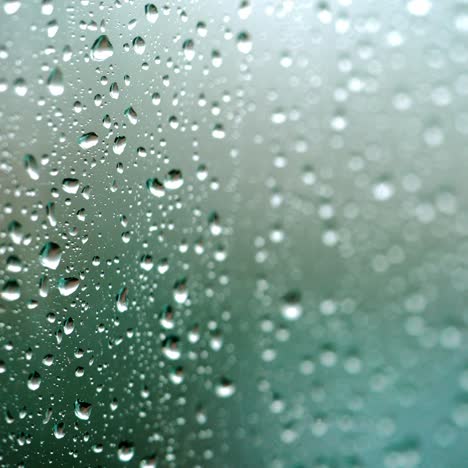 rain falling on glass during rain storm.