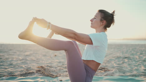 yoga teacher practicing morning yoga outdoors.