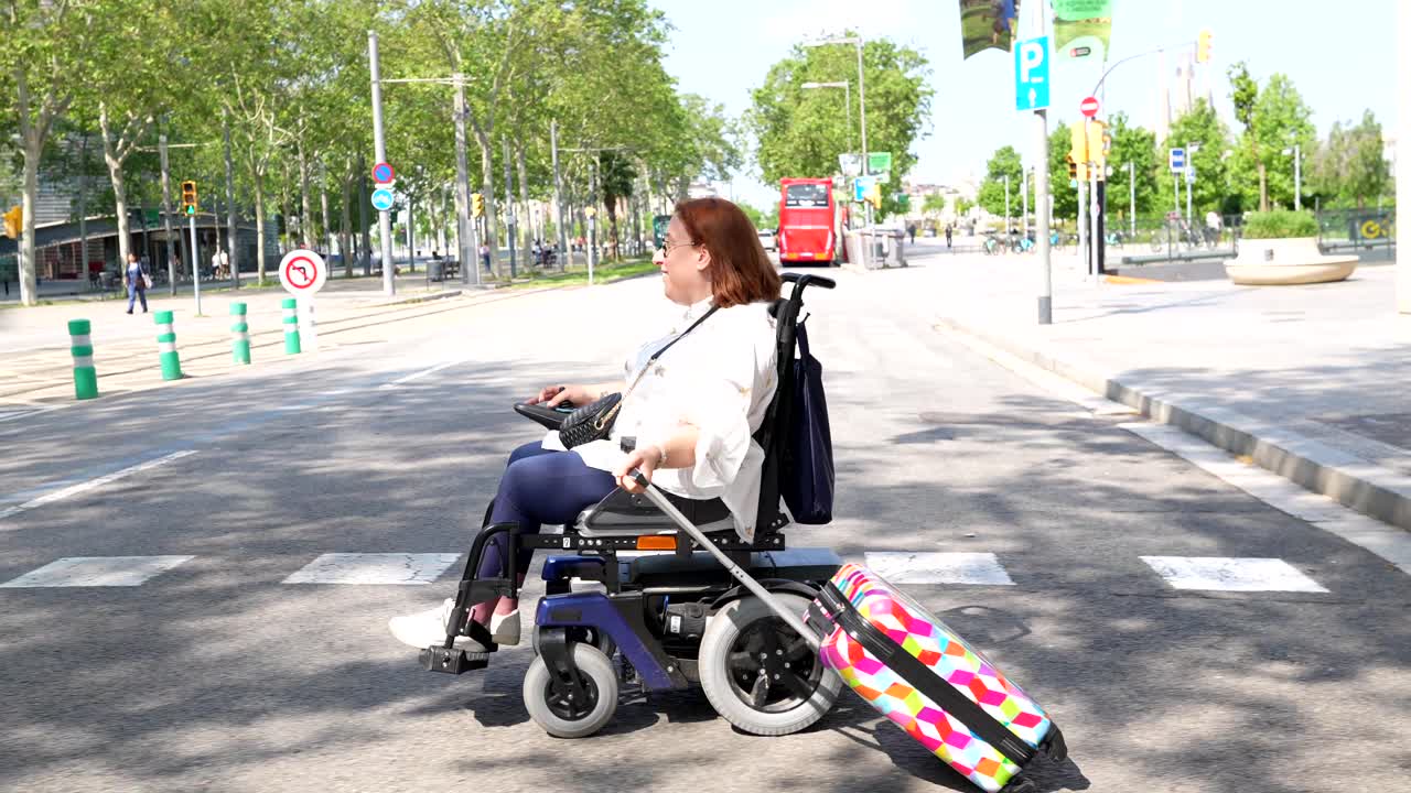 Woman in Wheelchair Traveling with Luggage in the City
