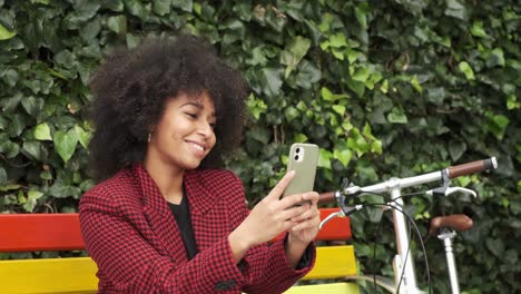 smiling black woman taking selfie