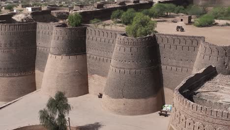 cinematic footage of derawar fortress in the cholistan desert shot from above