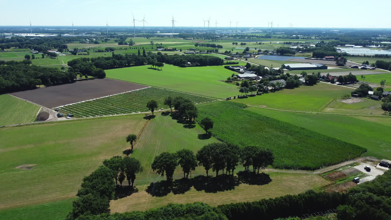 Aerial View of Dutch Farmland and Wind Turbines
