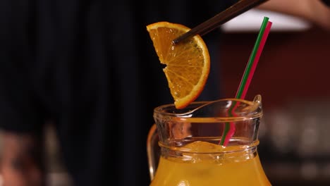 orange juice cocktail at a bar
