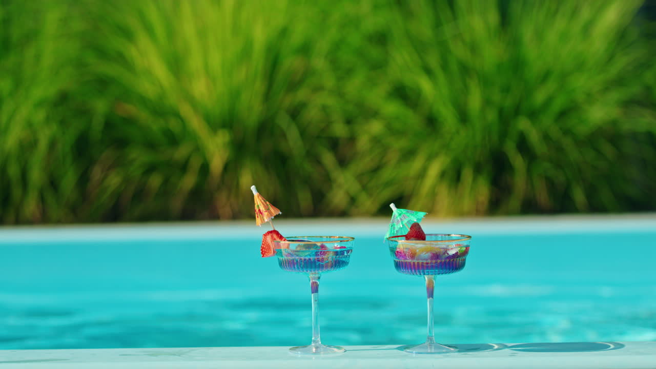 Two Colorful Cocktails by the Pool