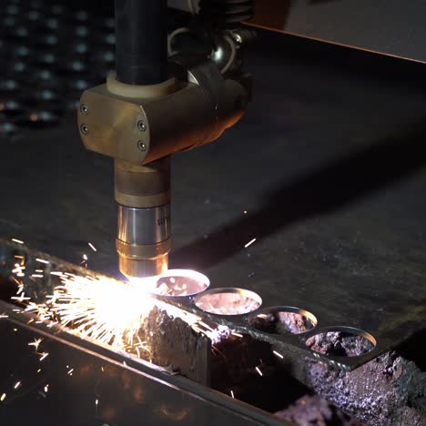 plasma cutting of metal on an automatic laser machine. laser cutter in the production. manufacturing plant.