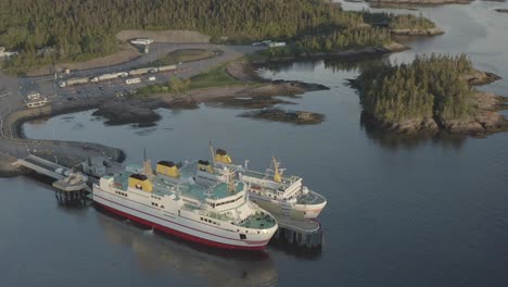 Drone-up-pan-down-of-ferries-unloading