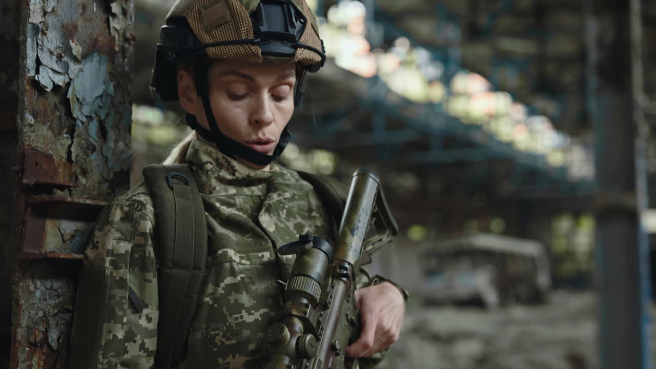 Woman Soldier with Rifle in Abandoned Building