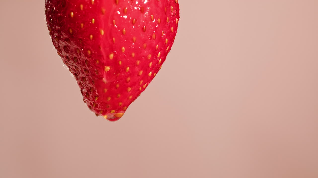 Close-up of a wet strawberry with a water drop