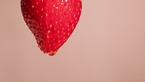 close-up of a wet strawberry with a water drop