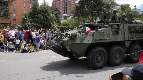 soldiers saluting in armored vehicle. lav iii. colombian army military parade. independence day, july 20th