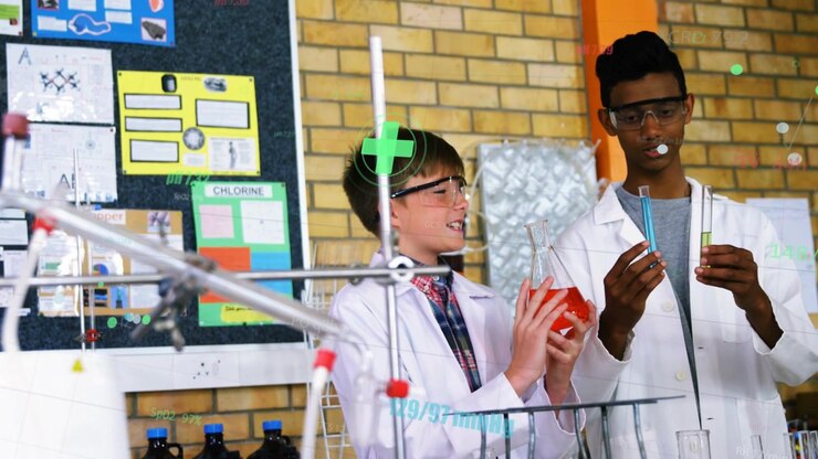 Students comparing tubes in chem lab after red flask lift, crosshair appearing over left student