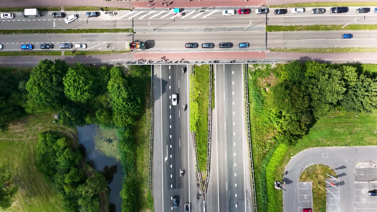 Aerial View of Highway Intersection with People and Vehicles