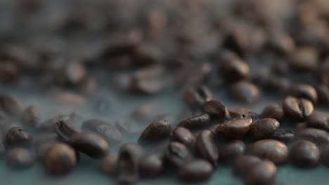 macro zoom out to a steaming coffee beans