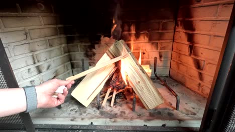 lighting a fire in a fireplace