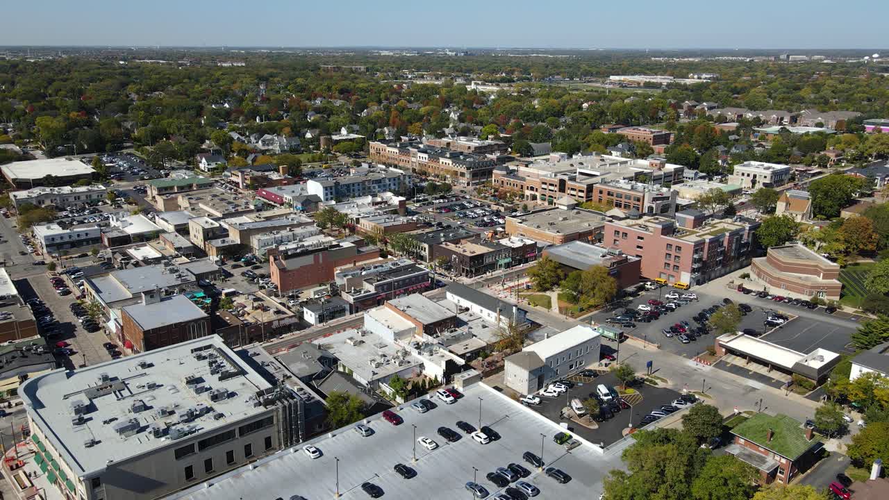 Naperville, IL, a Chicago suburb, on a sunny fall day, featuring buildings, streets. Dolly Backward Day NW