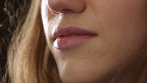 Closeup of smiling woman&#039;s lips