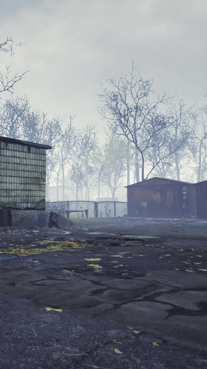 Misty morning scene in a rustic settlement surrounded by barren trees