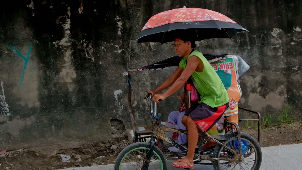 In parts of Cebu City, the oldest city in the Philippines, the backstreet pedicab or "trisikad" is still a useful means of ferrying individuals between their homes and the busier roadways.