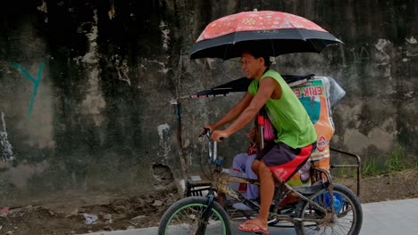 in parts of cebu city, the oldest city in the philippines, the backstreet pedicab or "trisikad" is still a useful means of ferrying individuals between their homes and the busier roadways.