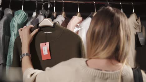 woman shopping for clothes in a store