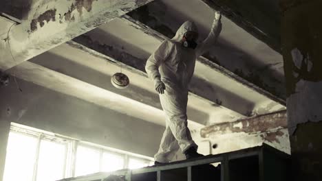 Worker-inside-the-ruined-building-in-abandoned-area