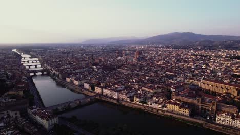 flying backwards drone shot around florence, italy