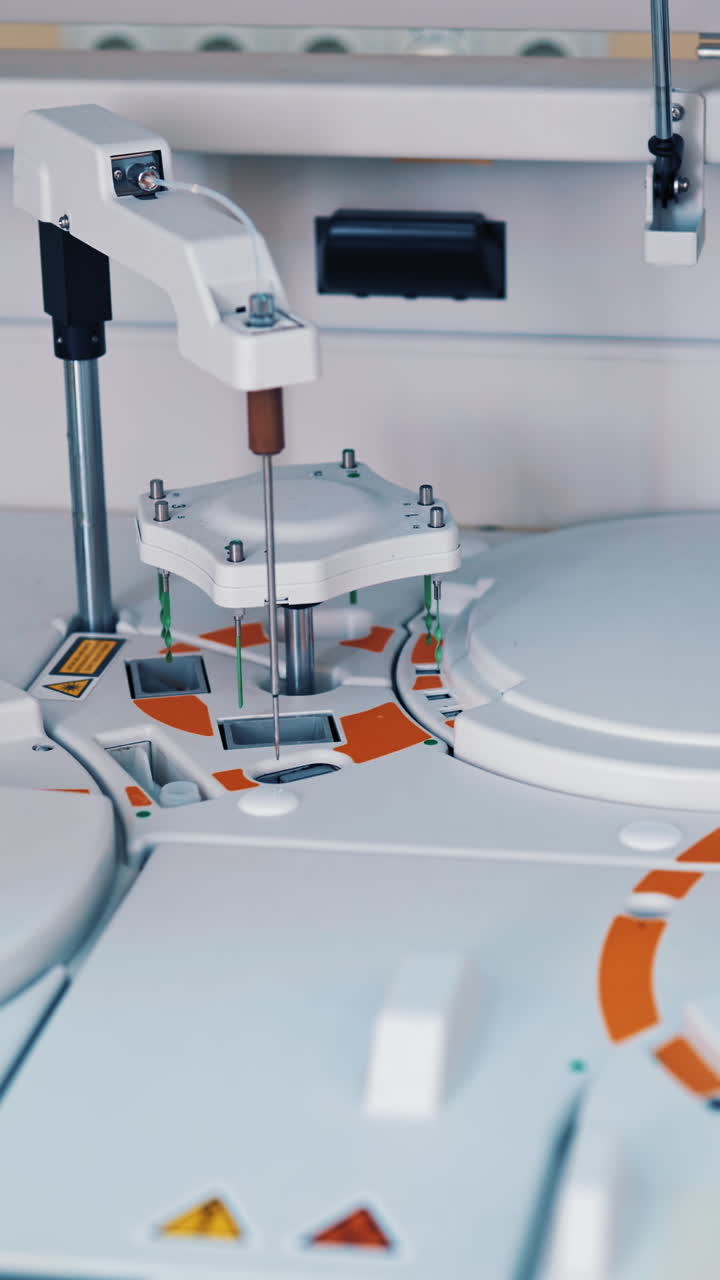 Modern robotic machine of checking blood samples in process in the laboratory. Analysis of liquid at medical clinic. Reseach and science concept. Slow motion. Vertical video