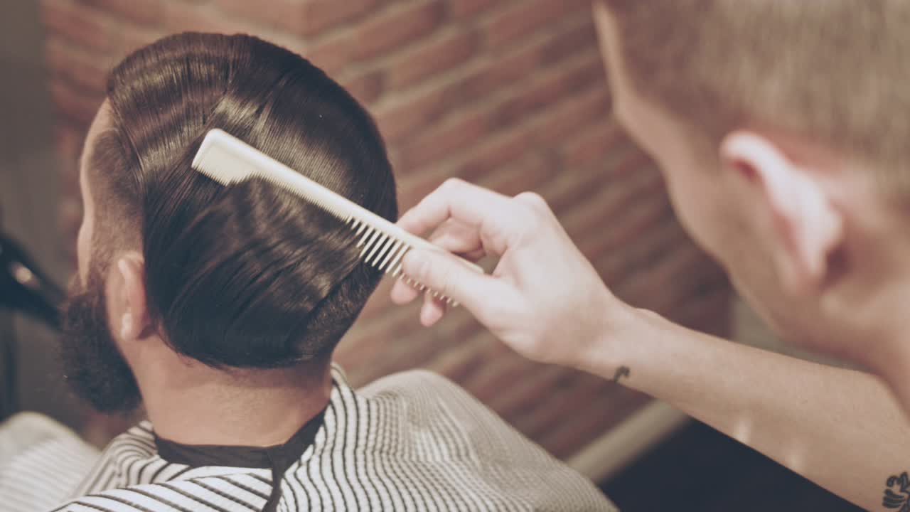 Male hairstyle. Barber haircut. Man hairstyle. Barber comb client