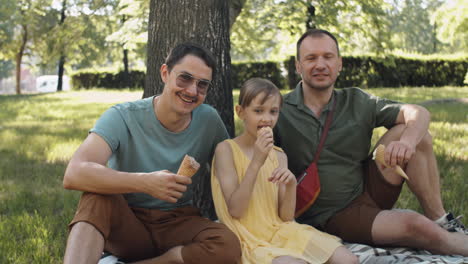 family relaxing in park