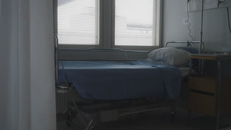 static view of empty bed in a hospital, ready to receive patients