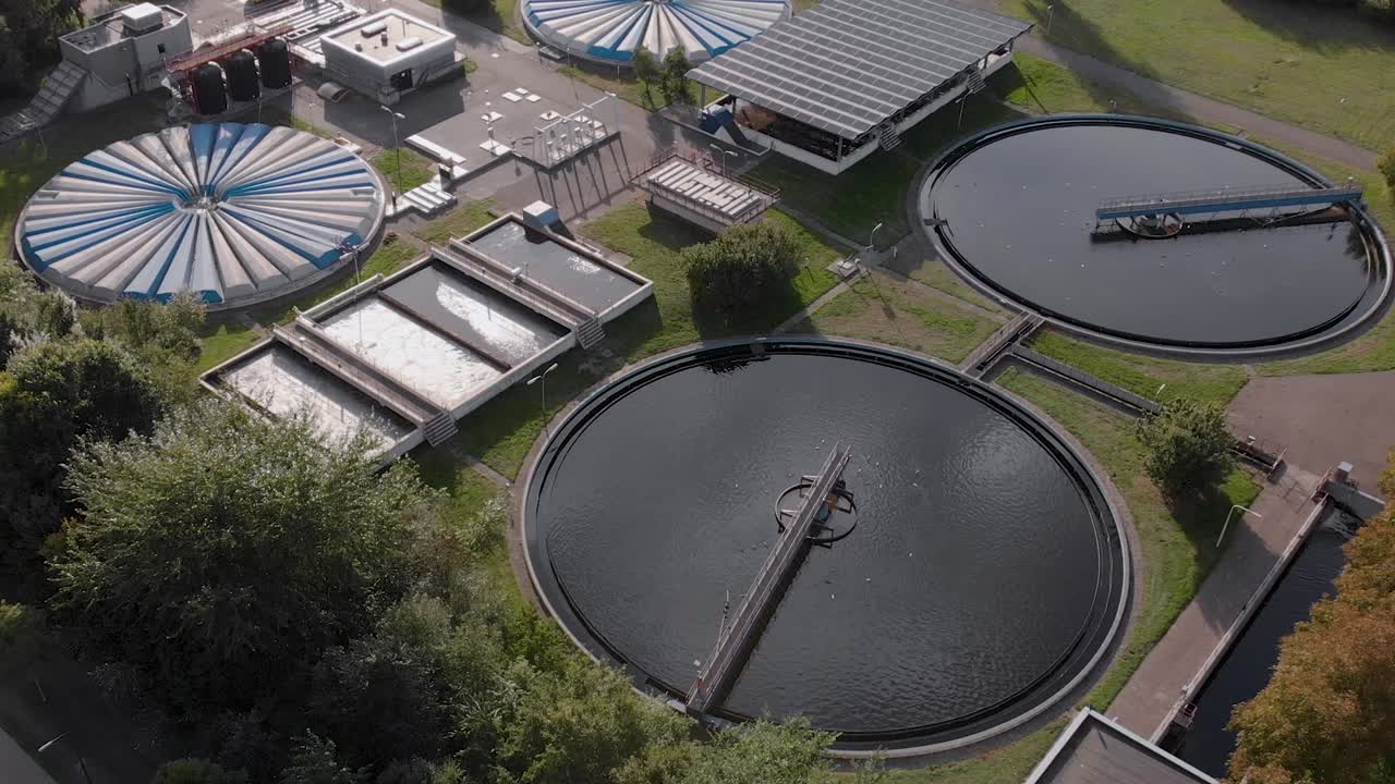 Aerial view of a water recycle reservoir in The Netherlands showing the various circular and rectangular forms of the water tanks of the facility