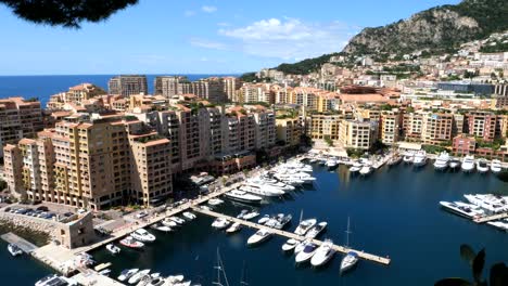 aerial panning shot of housing area with luxury apartment and parking yachts in harbor