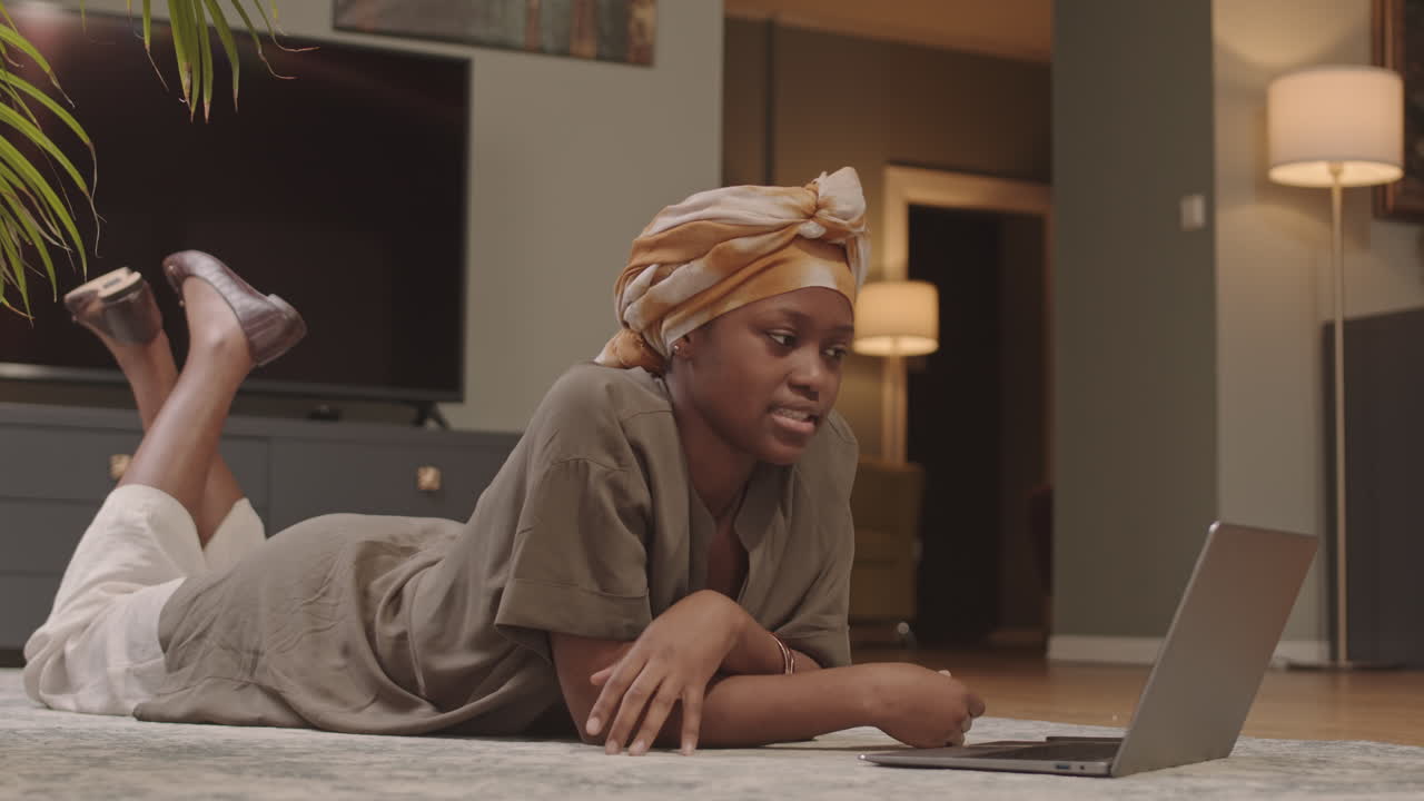 African American Woman Video Chatting at Home