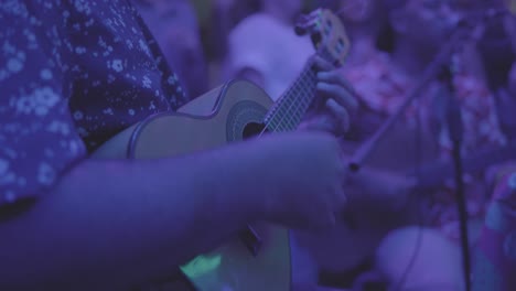 playing guitar during a roda de samba