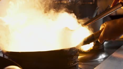 chef cooking in a wok: stir-fry and culinary delights