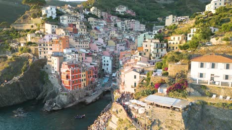 Drone-Flies-Away-from-Cinque-Terre-Coastline-at-Sunset