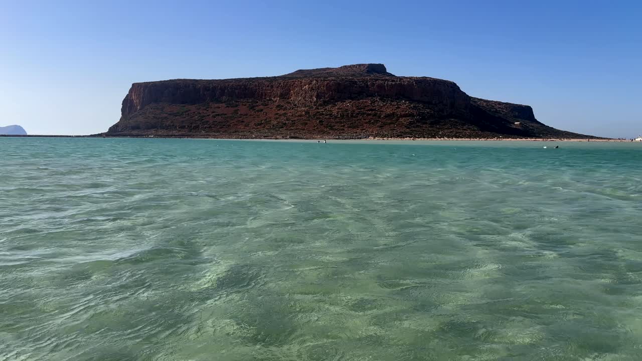 Balos Lagoon with clear shallow waters and central mountain, Crete, Greece