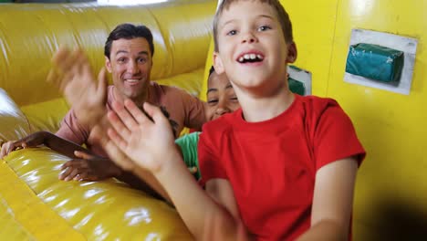 kids playing in bouncy castle 4k