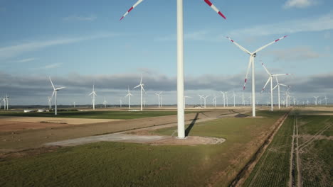 drone is heading towards the trunk of a wind mill