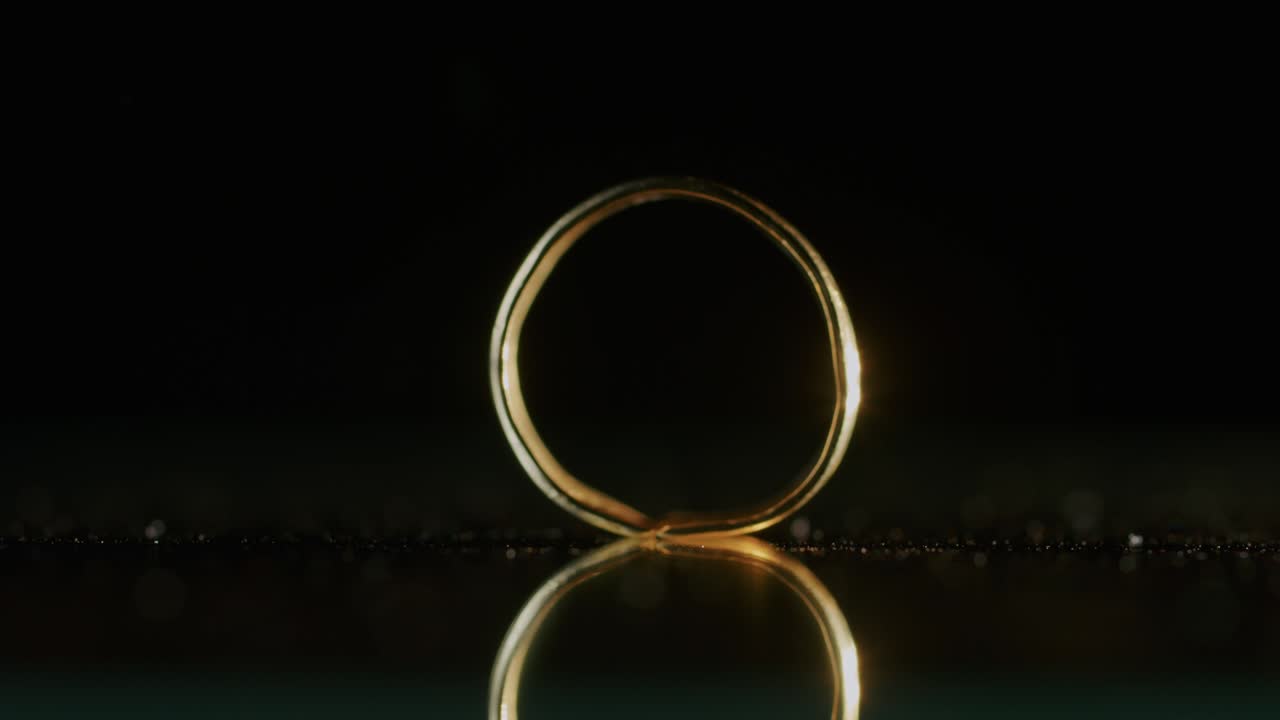 a gold ring of a Scythian priestess 2000 years old, an old earring, a spinning wheel, found during excavations. vintage jewelry. religion. close-up