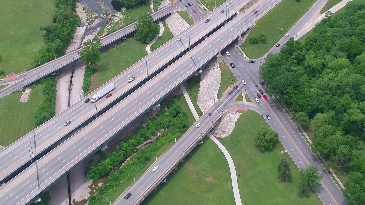 Traffic flows through an intersection in the USA during daytime
