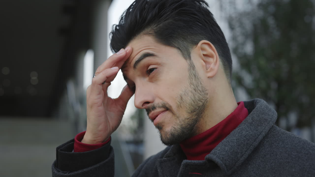 A man experiences stress and sadness