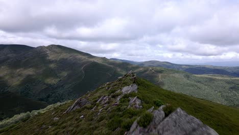 Aerial-drone-footage-following-the-peak-of-a-mountain-trail