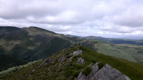 aerial drone footage following the peak of a mountain trail