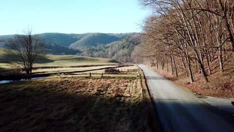 aerial push along country dirt road near boone and blowing rock nc, north carolina in the blue ridge and appalachian mountains