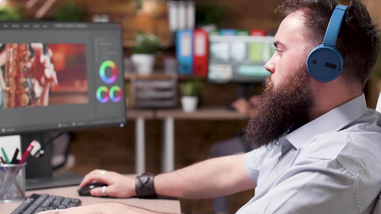 Man editing video on computer