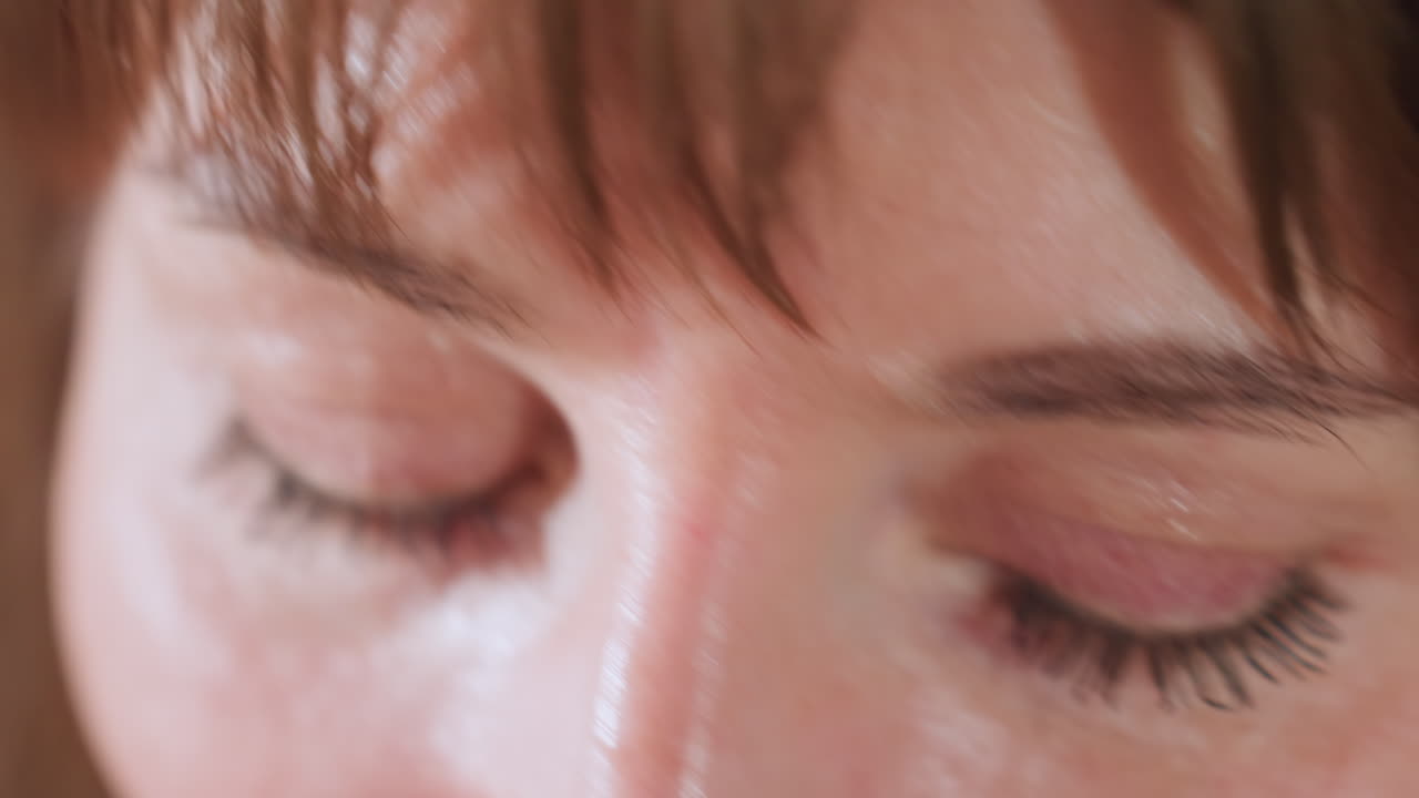 Eyes of relational expert blinking and listening attentively during supportive communication session with client, conveying understanding in therapeutic coaching context to build connection