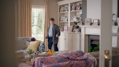 funny-teenage-boy-with-down-syndrome-dancing-in-living-room-having-fun-celebrating-with-silly-dance-moves-happy-kid-enjoying-weekend-at-home-4k