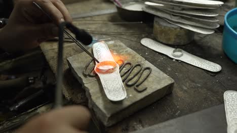 jeweler at work in jewelry. desktop for craft jewelry making with professional tools. close up view of tools.