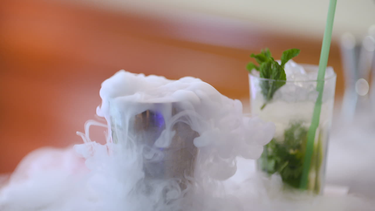 Dry Ice In Glass While Bartender Preparing Drink 2